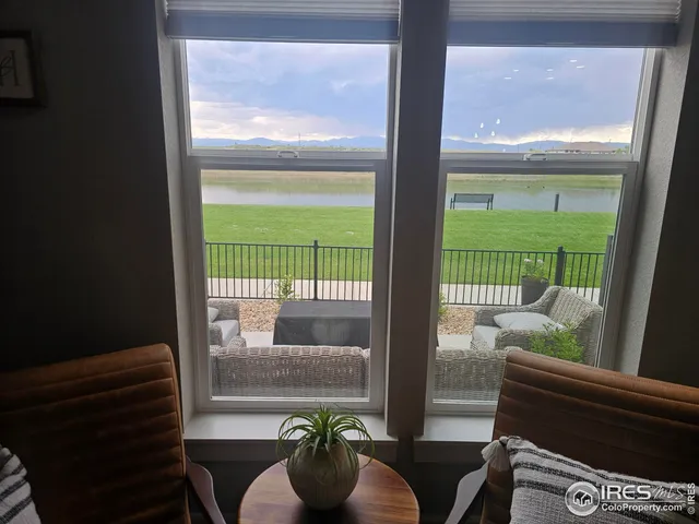 a view of a porch with furniture and garden