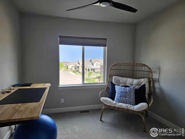 a bathroom with a granite countertop sink a toilet and a mirror