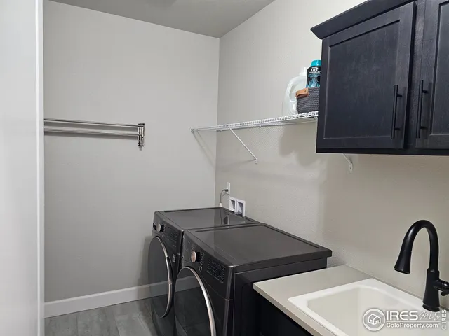 a kitchen with a sink cabinets and window