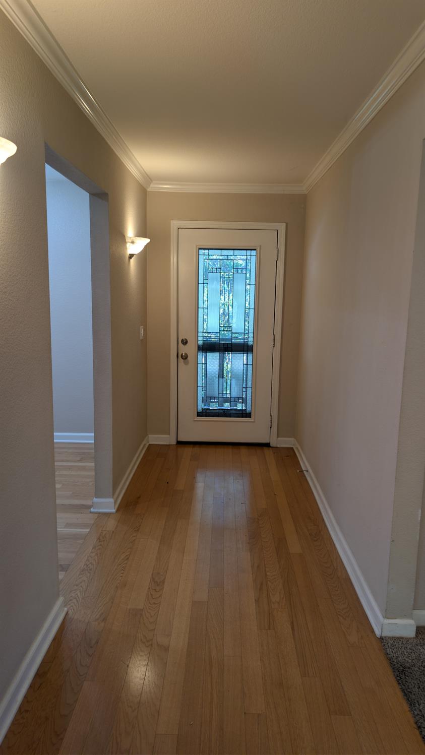3248 Sudbury Road Cameron Park, CA 95682 - Photo 11 of 41 a view of an empty room with a window and wooden floor