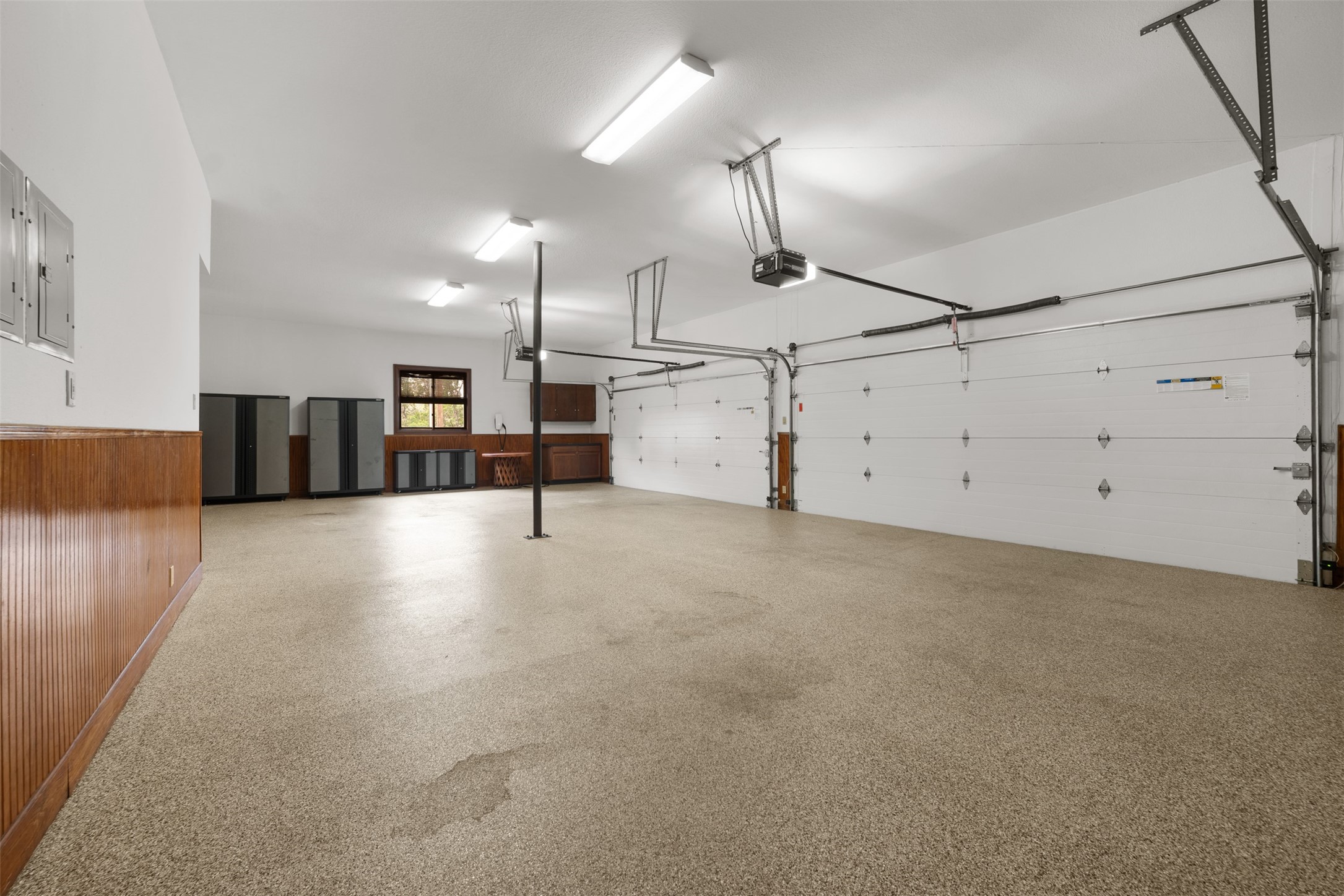 34000 Smithson Valley Road Bulverde, TX 78163 - Photo 26 of 50 The oversized four-car garage features durable epoxy flooring, built-in storage, and ample space for vehicles, equipment, and hobbies. Designed for both functionality and organization.