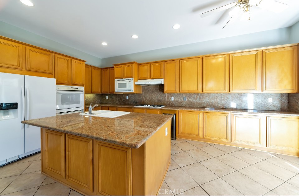 3655 Cll Joaquin Calabasas, CA 91302 - Photo 3 of 15 a kitchen with a sink a cabinets and window