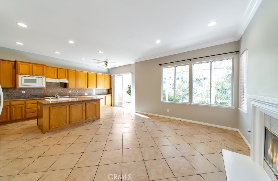 3655 Cll Joaquin Calabasas, CA 91302 - Photo 4 of 15 a large kitchen with kitchen island granite countertop a large window and a counter top space