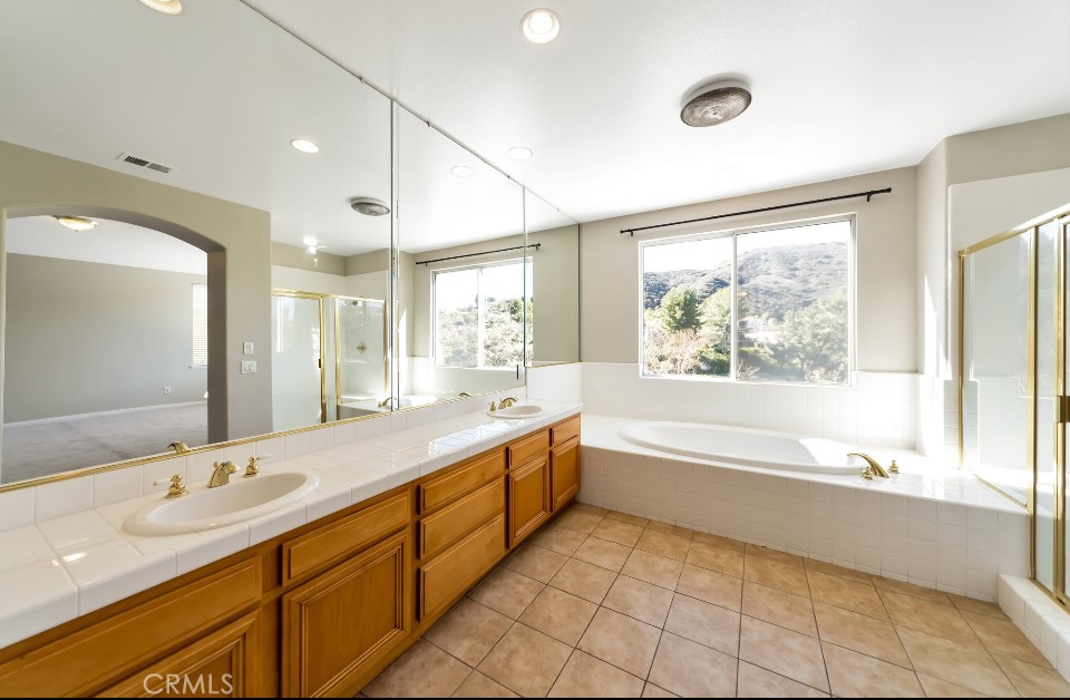 3655 Cll Joaquin Calabasas, CA 91302 - Photo 7 of 15 a bathroom with a large tub sink and double vanity