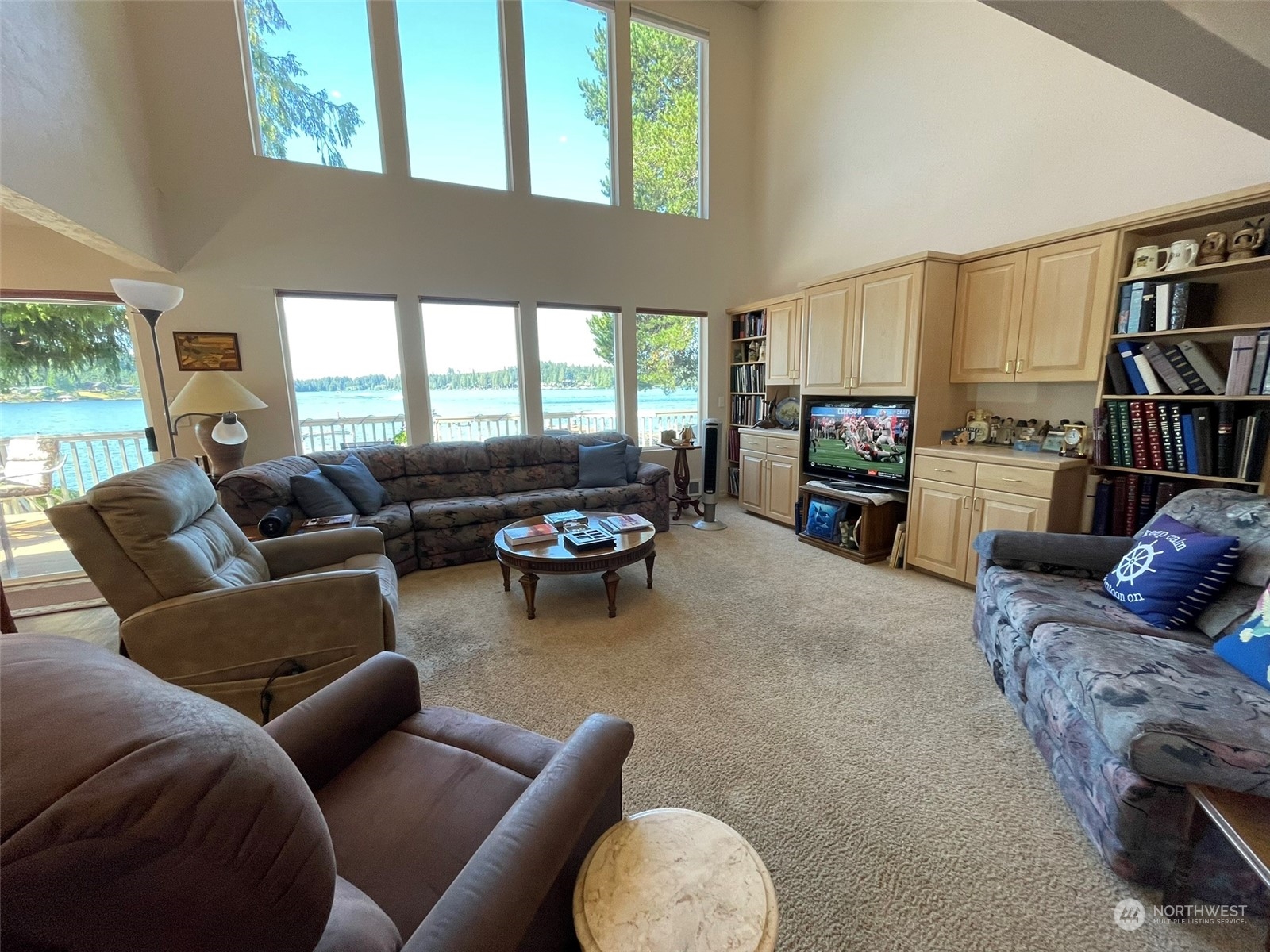 10 Shore Court Grapeview, WA 98546 - Photo 11 of 39 a living room with furniture fireplace and a large window