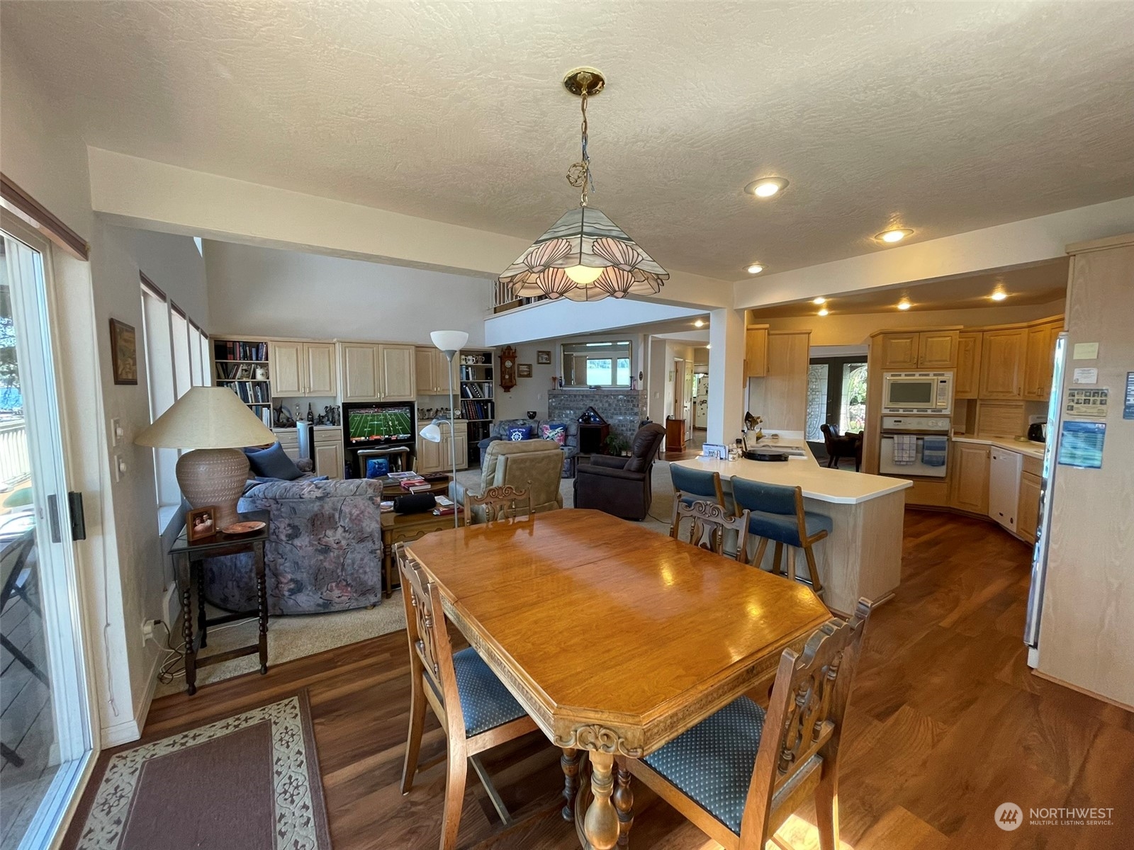 10 Shore Court Grapeview, WA 98546 - Photo 13 of 39 a view of a dining area with furniture window and wooden floor