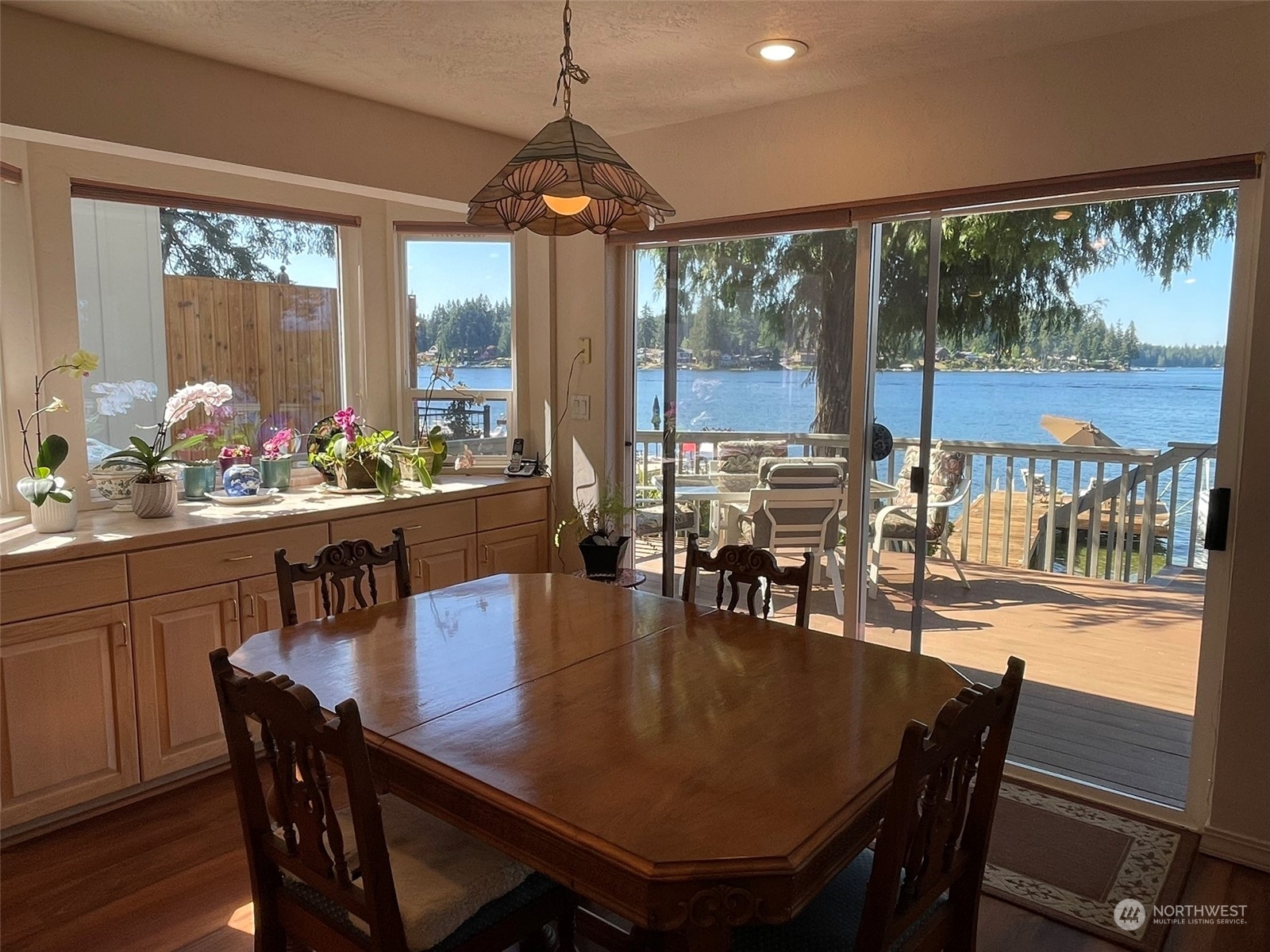 10 Shore Court Grapeview, WA 98546 - Photo 14 of 39 a view of a dining room with furniture window and outside view