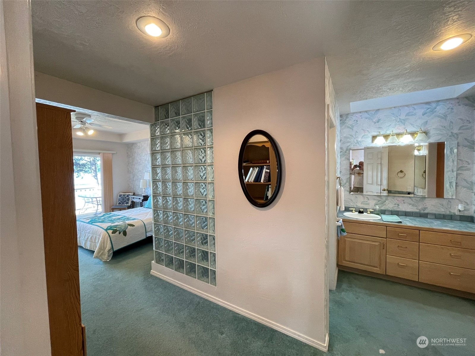 10 Shore Court Grapeview, WA 98546 - Photo 16 of 39 a en suite bathroom with a granite countertop sink and a mirror