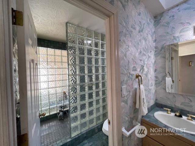 10 Shore Court Grapeview, WA 98546 - Photo 18 of 39 a bathroom with a sink and a shower