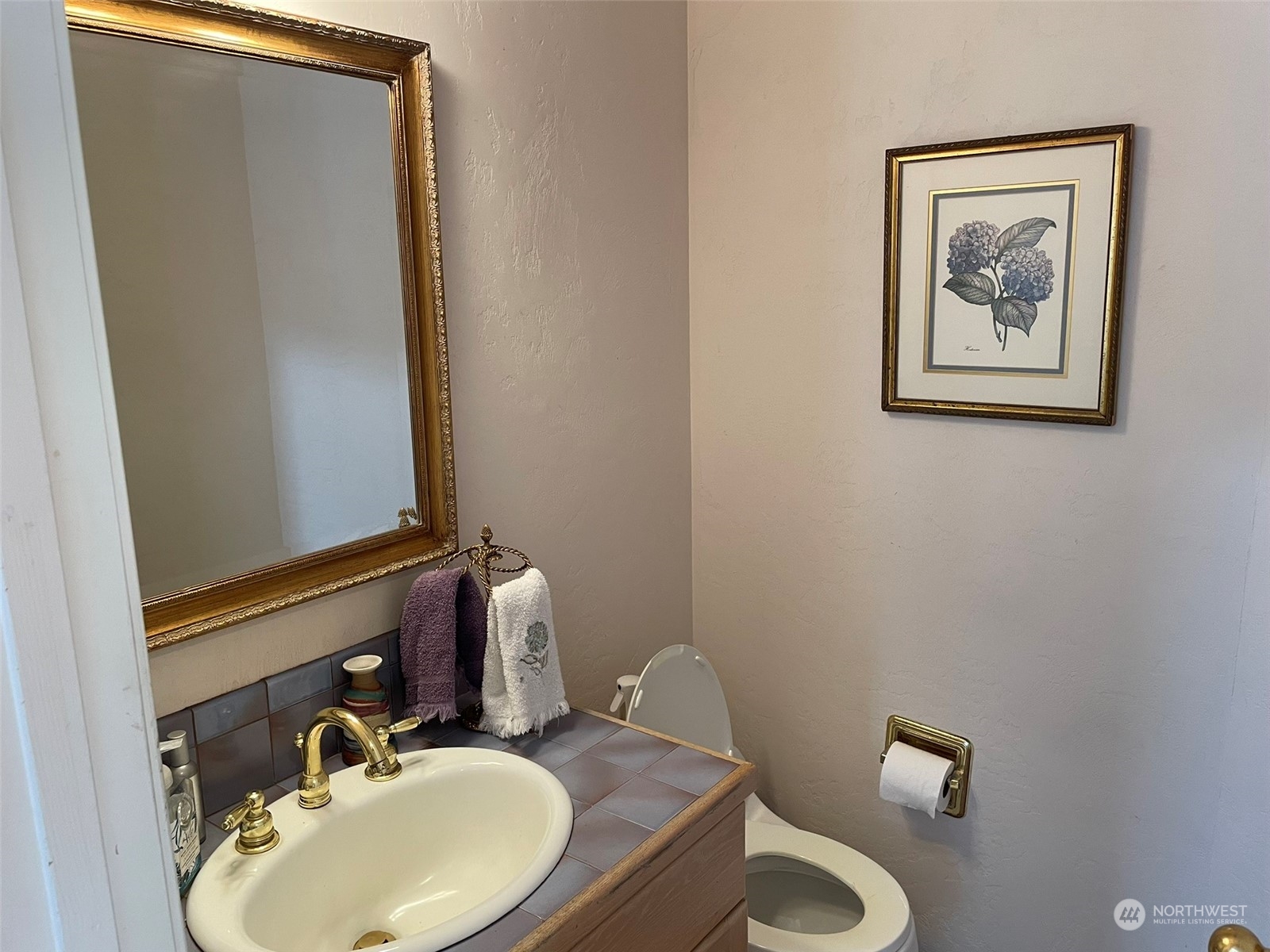 10 Shore Court Grapeview, WA 98546 - Photo 22 of 39 a bathroom with a toilet sink and mirror