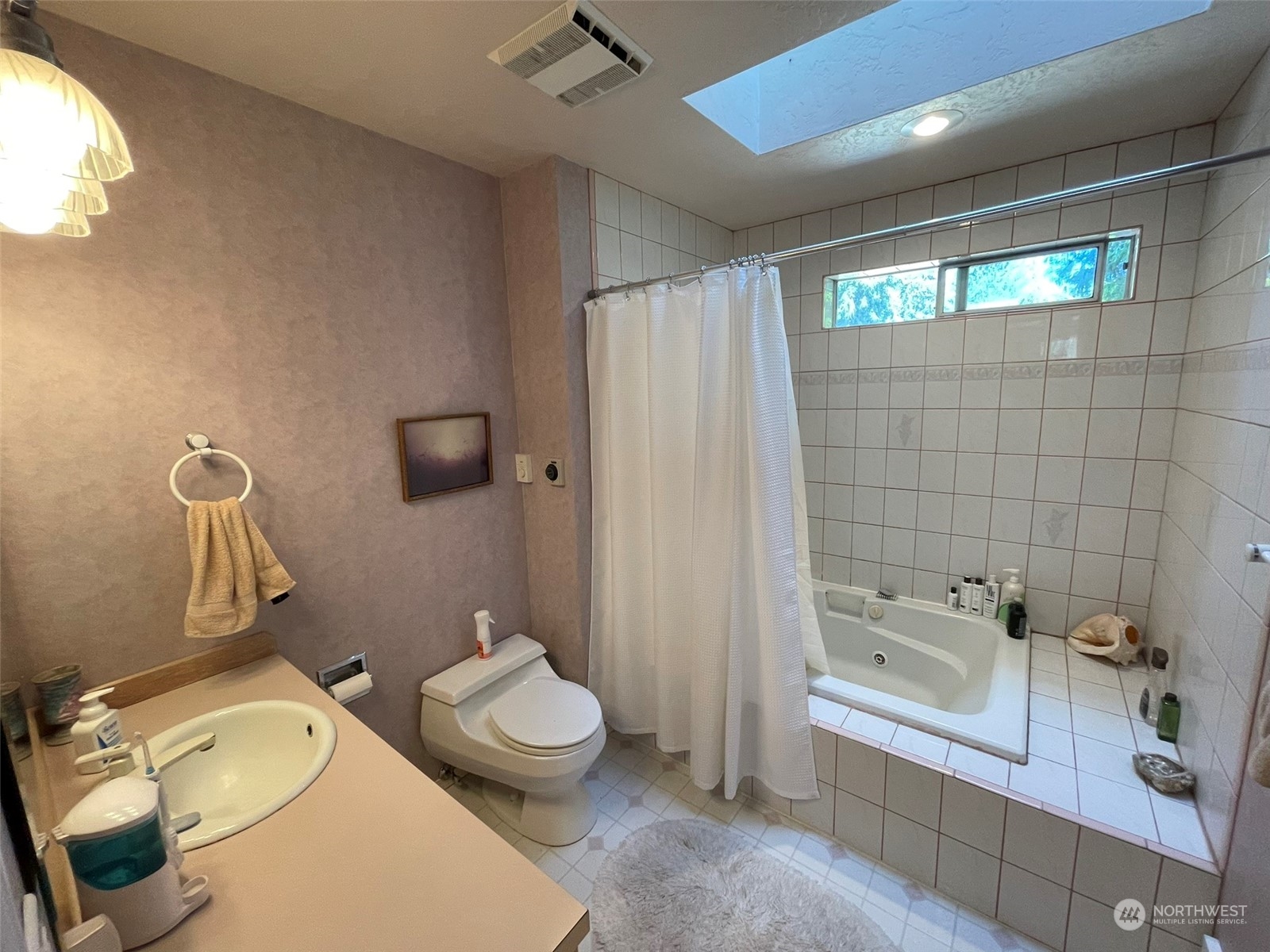 10 Shore Court Grapeview, WA 98546 - Photo 29 of 39 a bathroom with a sink mirror vanity and toilet