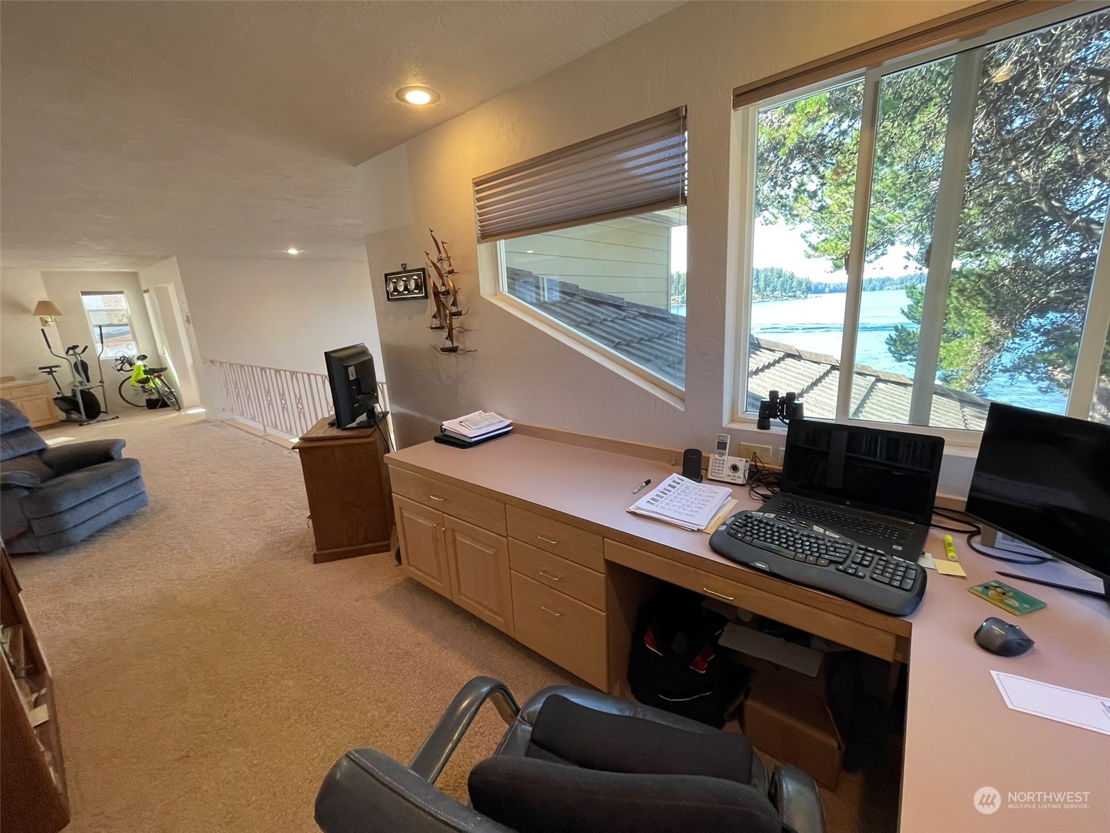 10 Shore Court Grapeview, WA 98546 - Photo 30 of 39 a workspace with furniture and a flat screen tv
