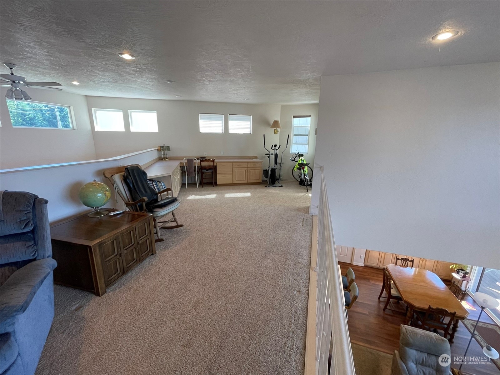 10 Shore Court Grapeview, WA 98546 - Photo 31 of 39 a living room with furniture and a wooden floor