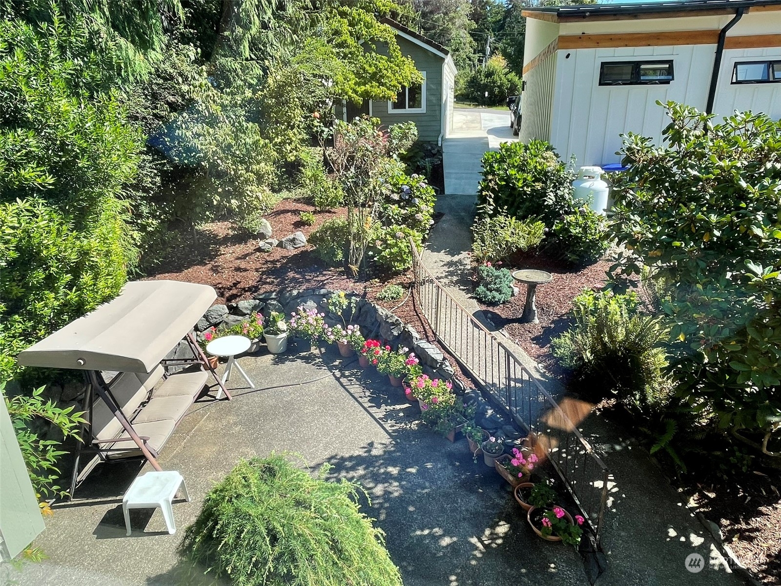 10 Shore Court Grapeview, WA 98546 - Photo 36 of 39 an aerial view of a house with a yard and garden