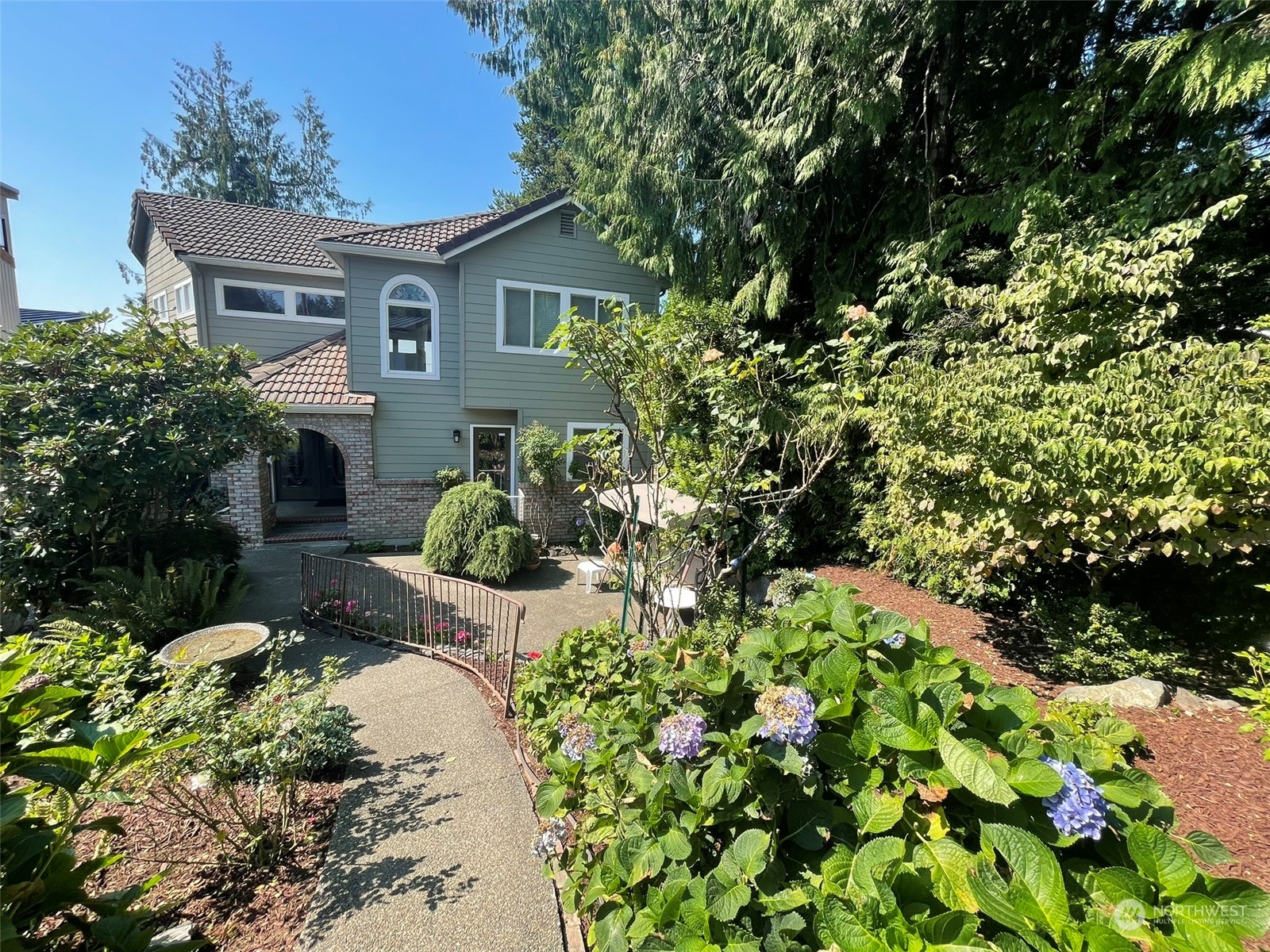 10 Shore Court Grapeview, WA 98546 - Photo 6 of 39 a view of a house with a yard and garden