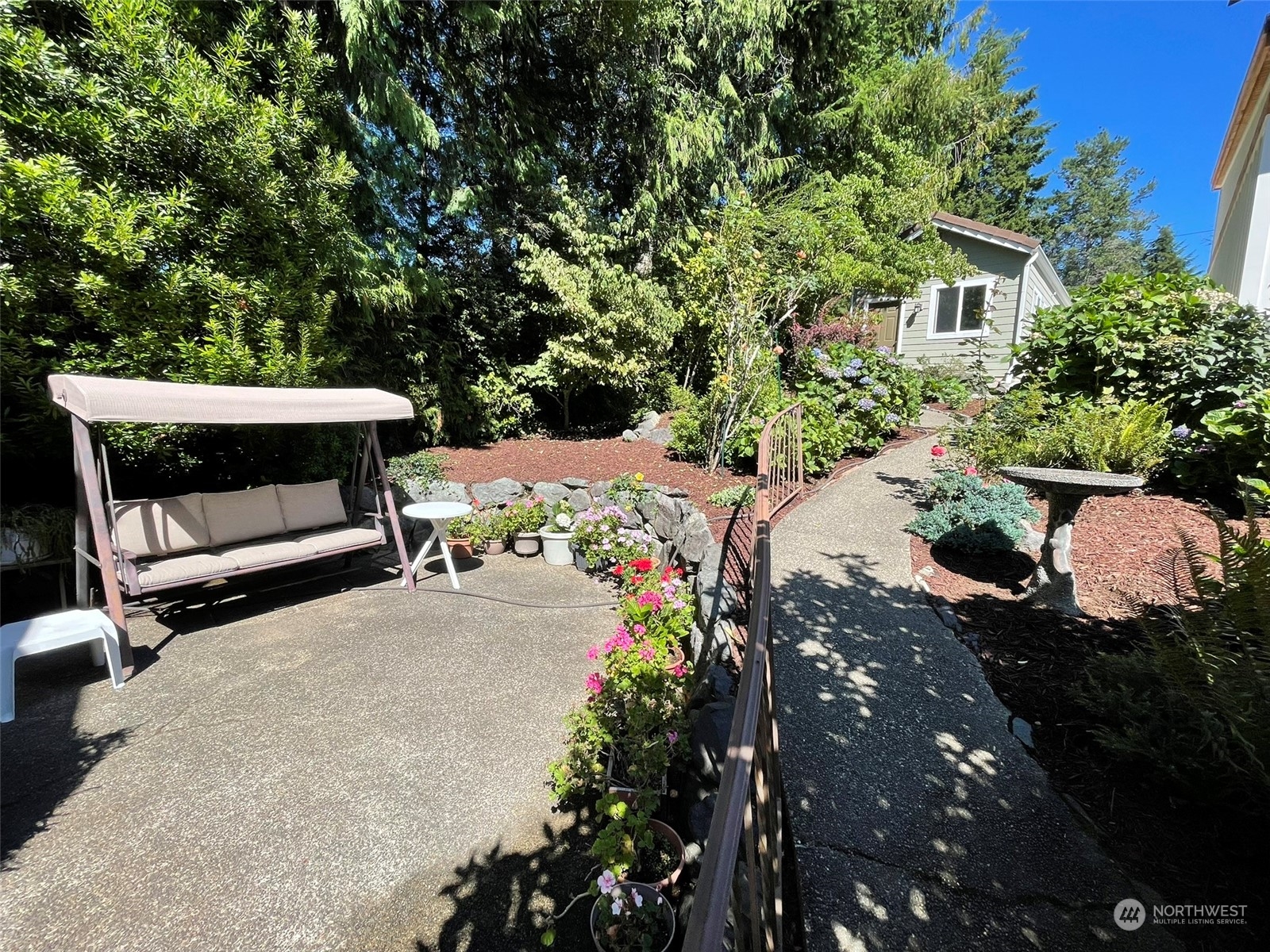 10 Shore Court Grapeview, WA 98546 - Photo 7 of 39 a view of backyard with outdoor seating and trees