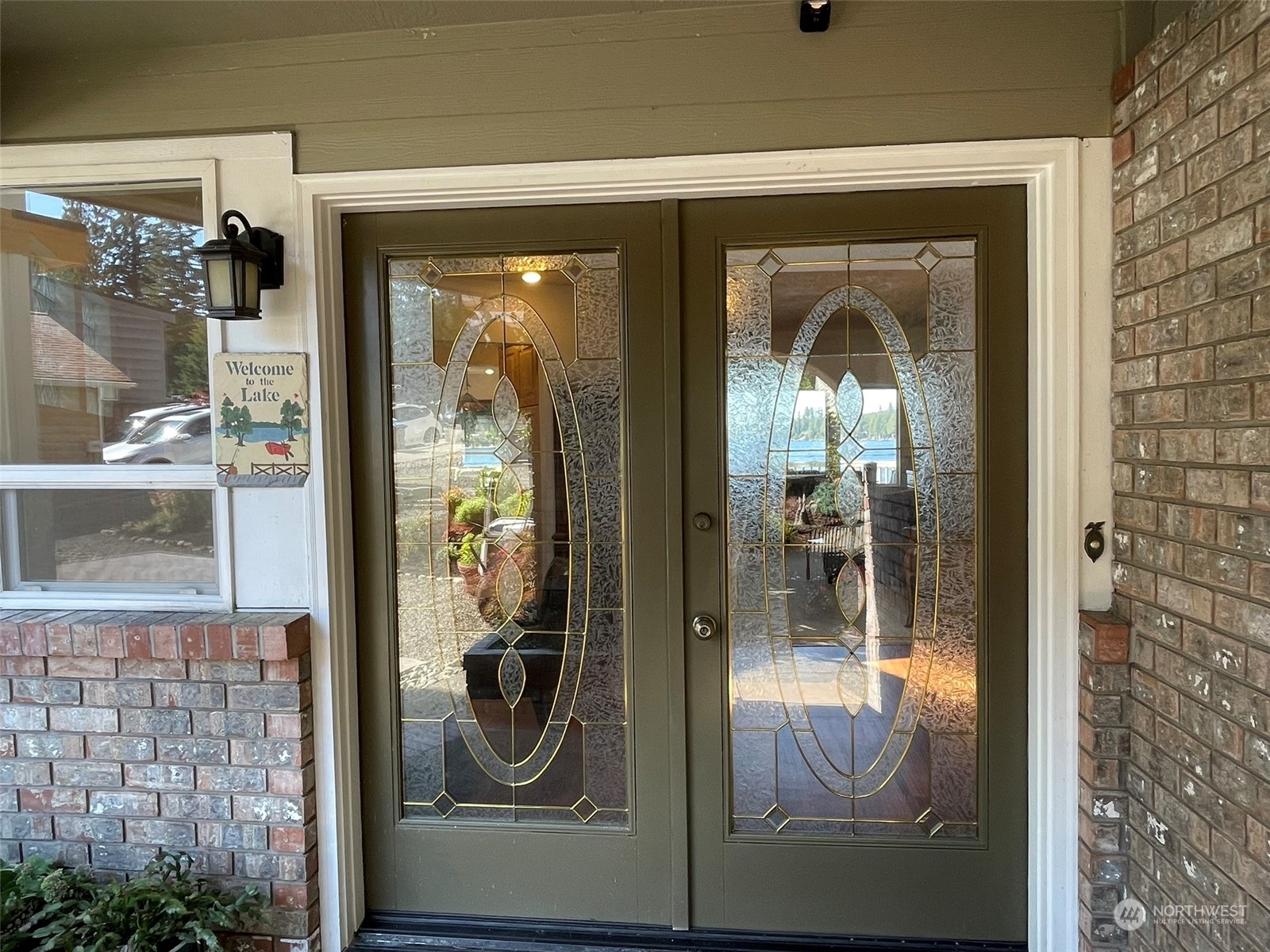 10 Shore Court Grapeview, WA 98546 - Photo 9 of 39 a view of a entryway door front of a house