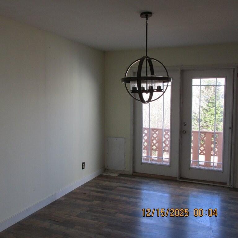 465 McMoon Lane Stuart, VA 24171 - Photo 6 of 16 a room with lots of windows and wooden floor