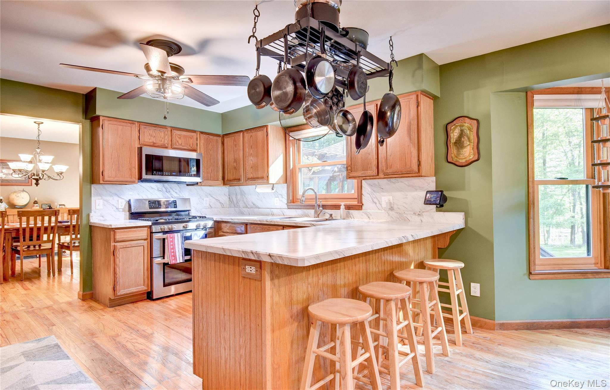29 Valley View Road Bloomingburg, NY 12721 - Photo 9 of 50 a kitchen with stainless steel appliances granite countertop a sink and a stove