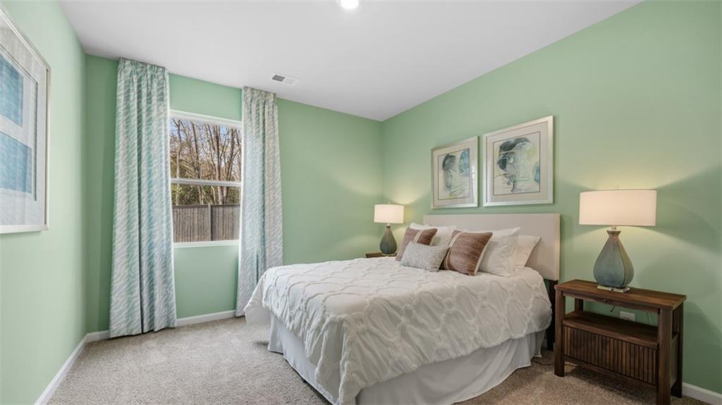 460 Bullock Pass Jefferson, GA 30549 - Photo 21 of 60 a bedroom with a bed and a window