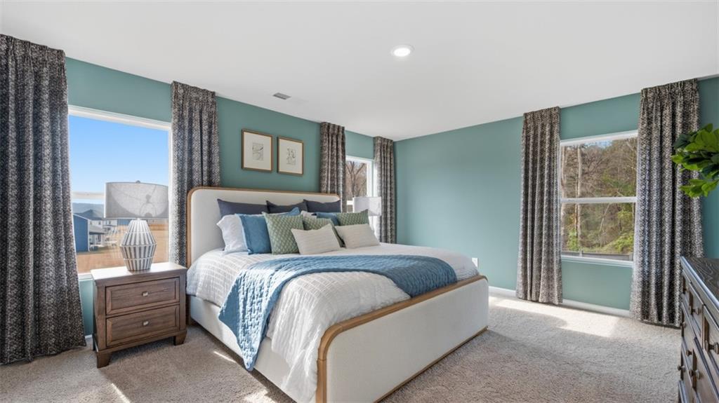 460 Bullock Pass Jefferson, GA 30549 - Photo 26 of 60 a bedroom with a bed and a night stand
