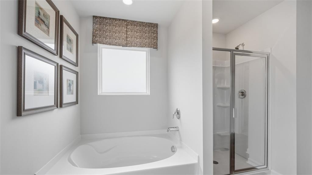 460 Bullock Pass Jefferson, GA 30549 - Photo 33 of 60 a white bath tub sitting next to a small window