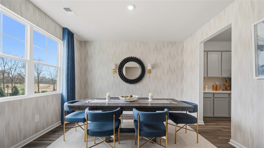 460 Bullock Pass Jefferson, GA 30549 - Photo 4 of 60 a view of a dining room with a table and chairs