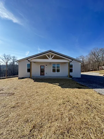 a view of a kitchen with wooden floor and a kitchen