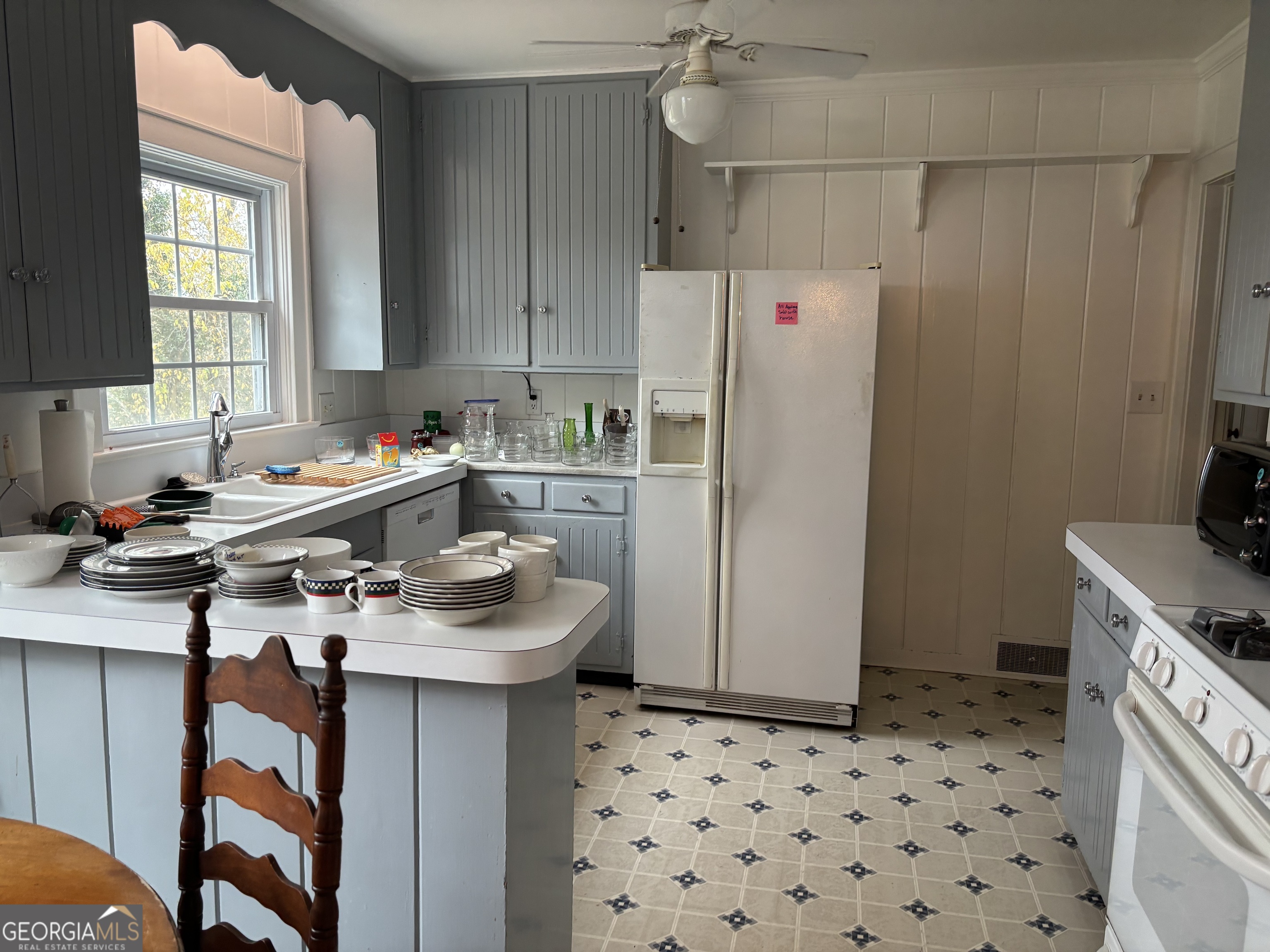 9 Eastridge Court Rome, GA 30161 - Photo 11 of 41 a kitchen with a sink a refrigerator and a stove