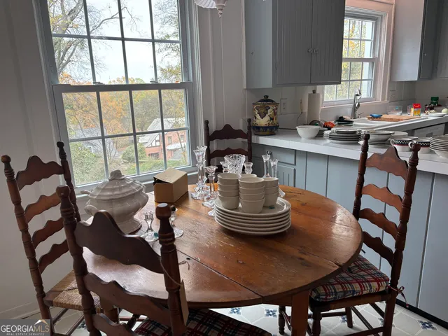 a view of a dining room with furniture window and outside view