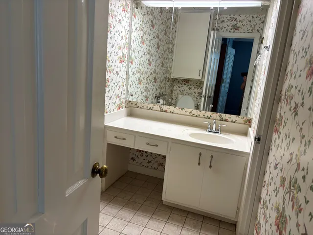 a bathroom with a sink double vanity and a mirror