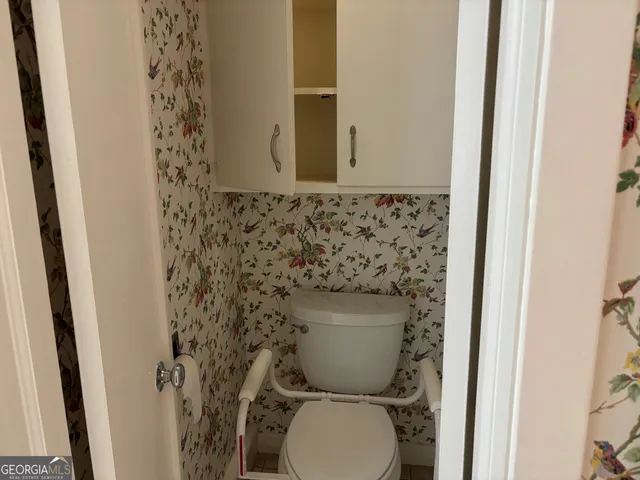 a bathroom with a toilet and a sink
