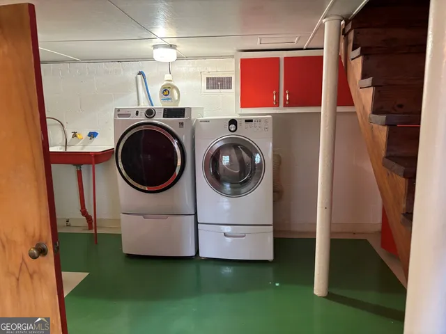 a utility room with dryer and washer