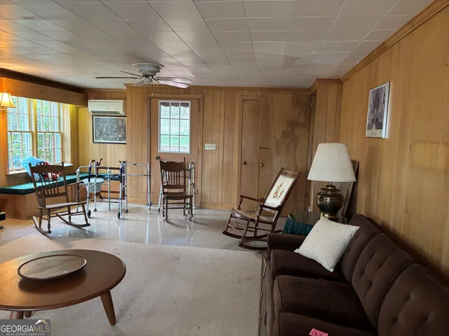a living room with furniture a fireplace and a table
