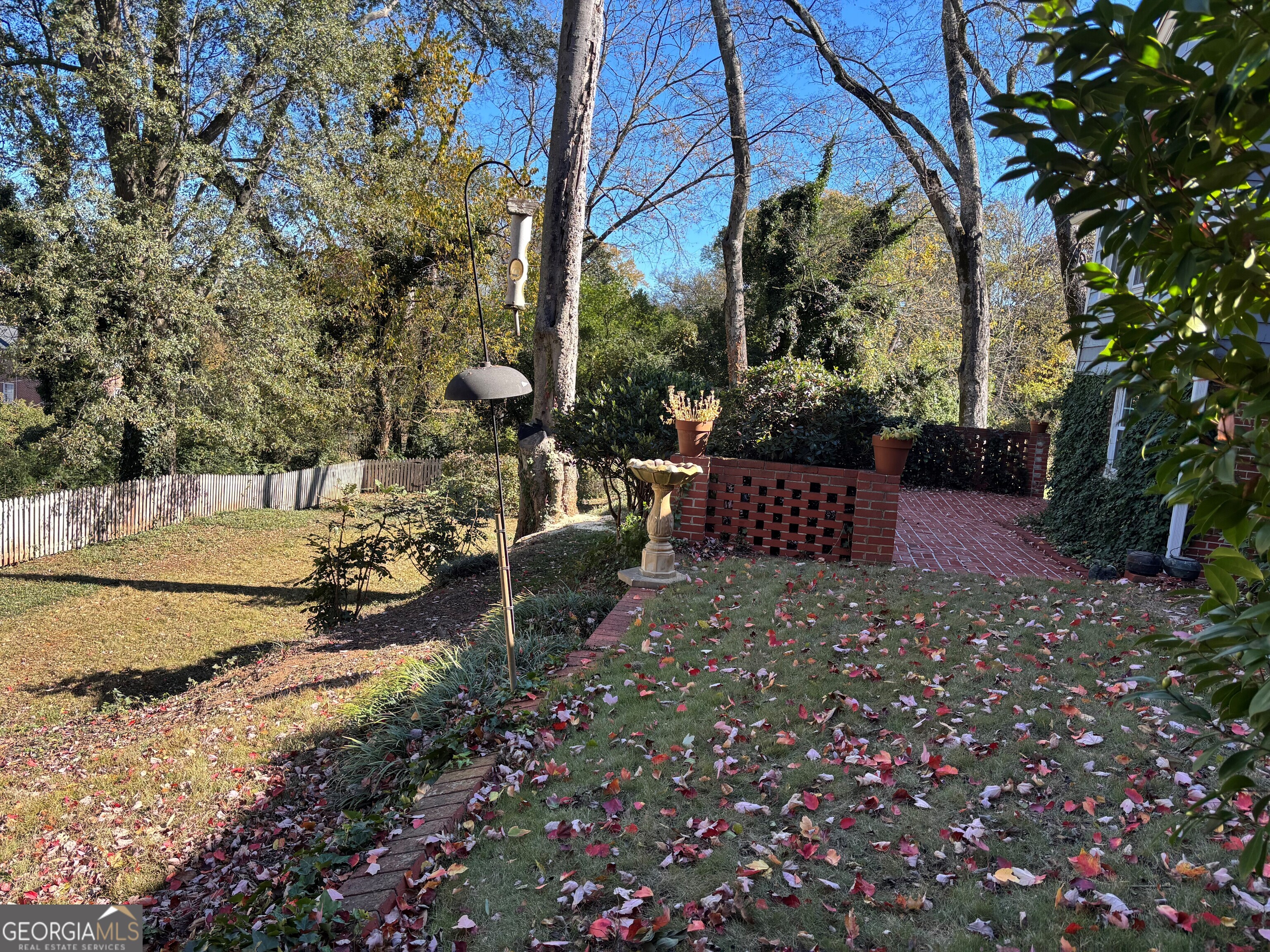 9 Eastridge Court Rome, GA 30161 - Photo 33 of 38 a view of backyard with a table and chairs and wooden fence