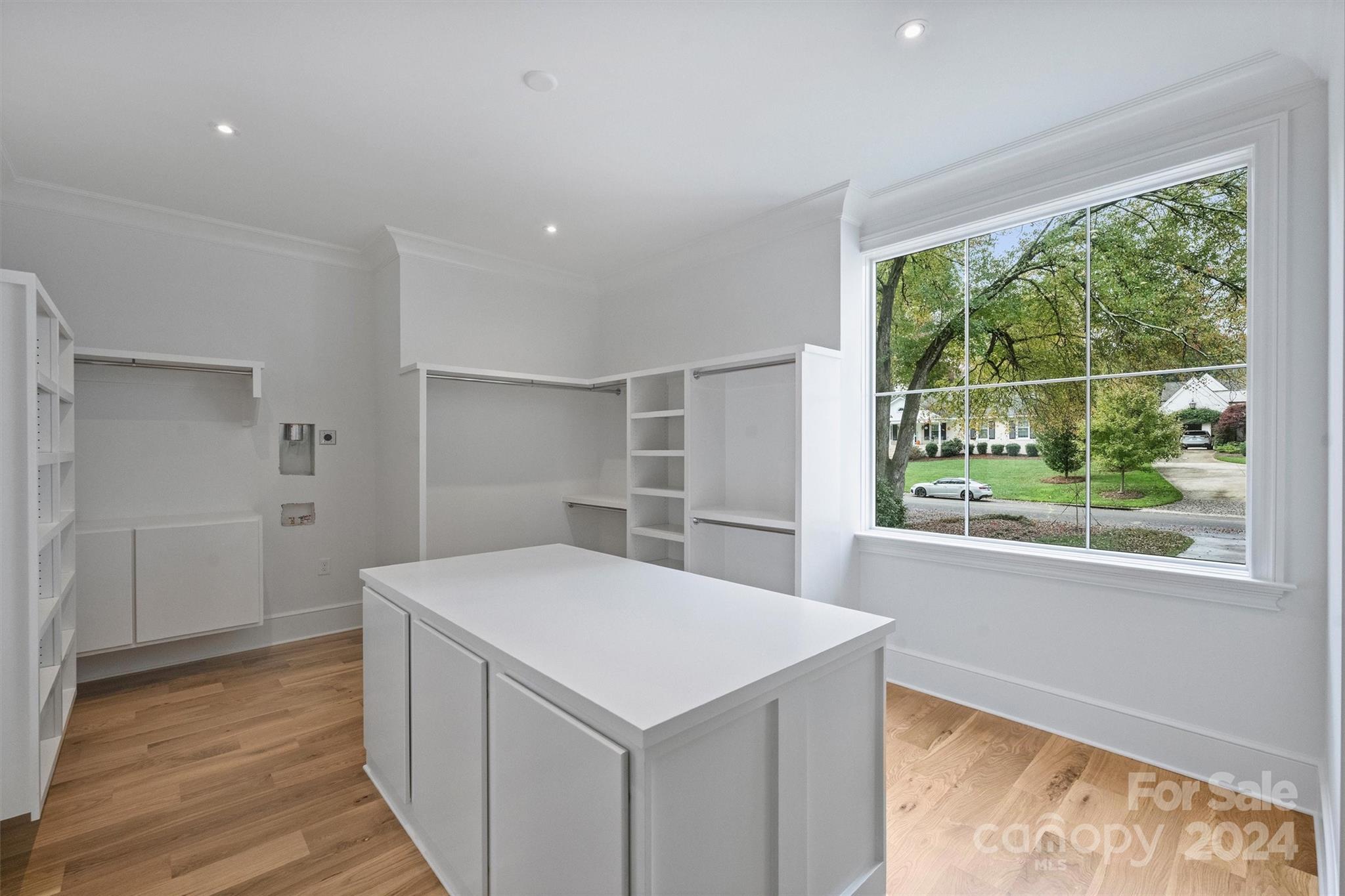 1601 Coventry Road Charlotte, NC 28211 - Photo 17 of 40 a kitchen with a stove a refrigerator a sink and wooden floor