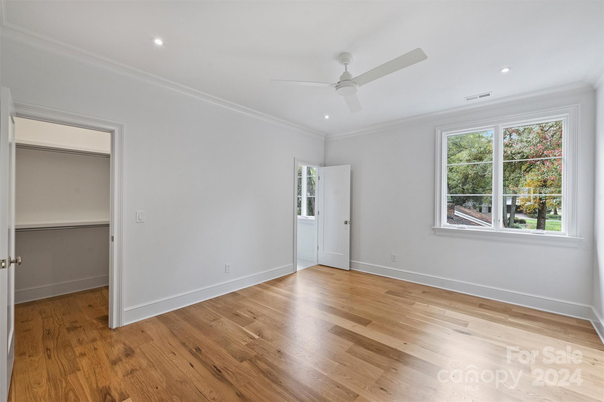 1601 Coventry Road Charlotte, NC 28211 - Photo 22 of 40 a view of an empty room with wooden floor and a window