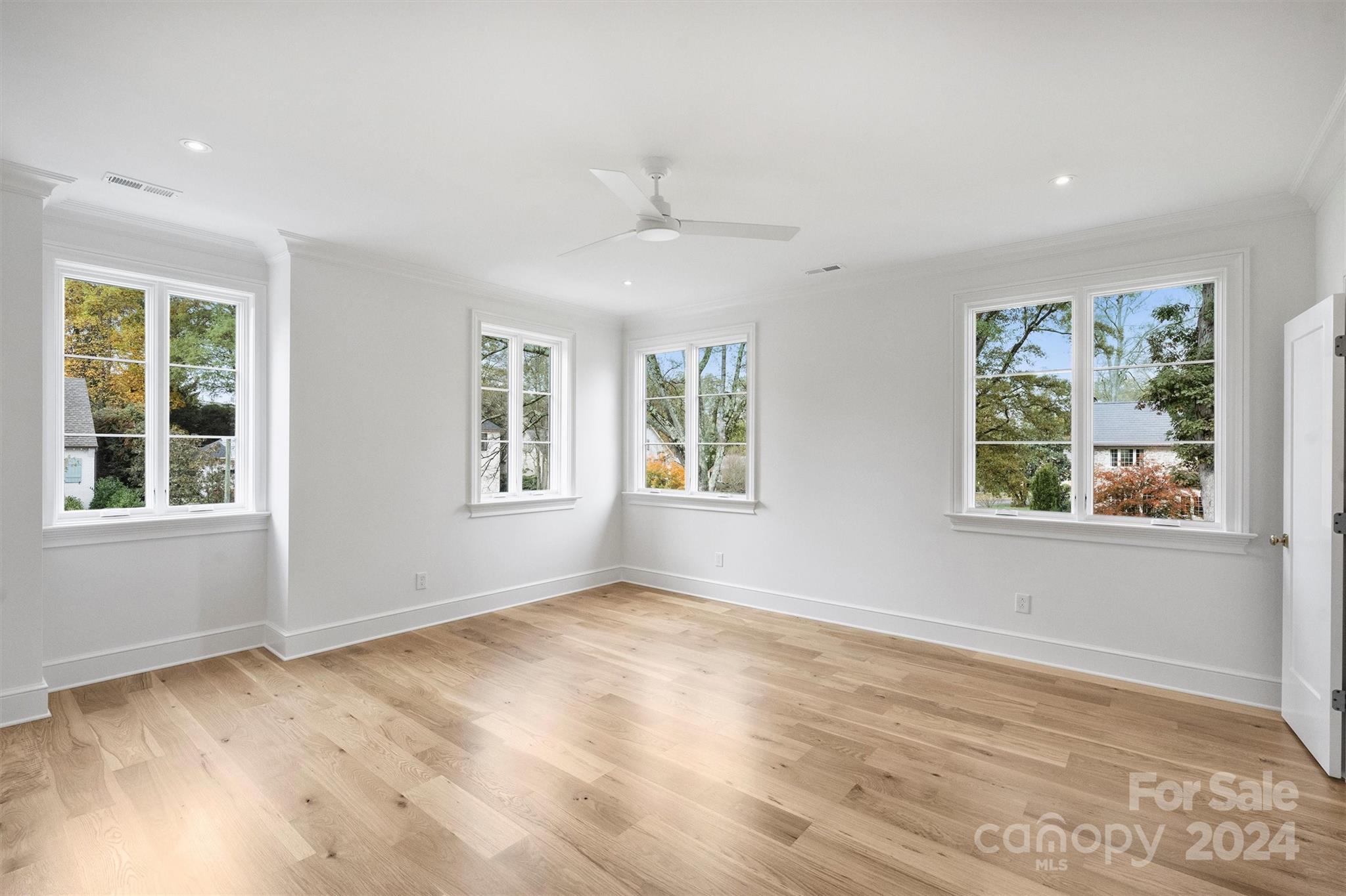 1601 Coventry Road Charlotte, NC 28211 - Photo 24 of 40 a view of an empty room with a window and wooden floor