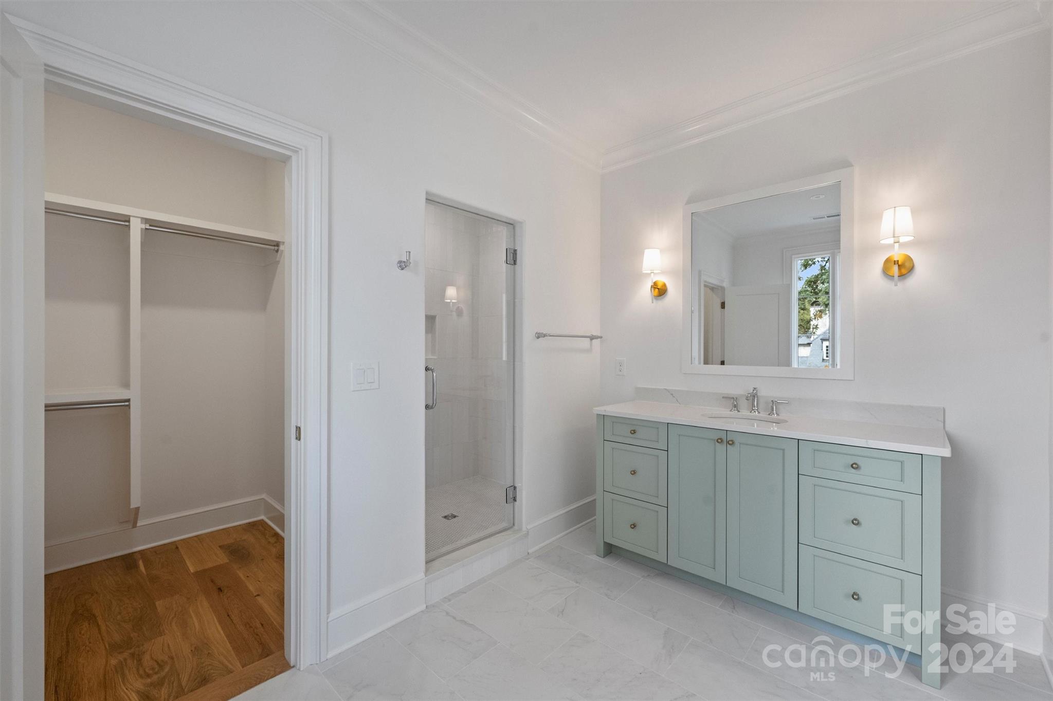 1601 Coventry Road Charlotte, NC 28211 - Photo 25 of 40 a spacious bathroom with a double vanity sink and a mirror