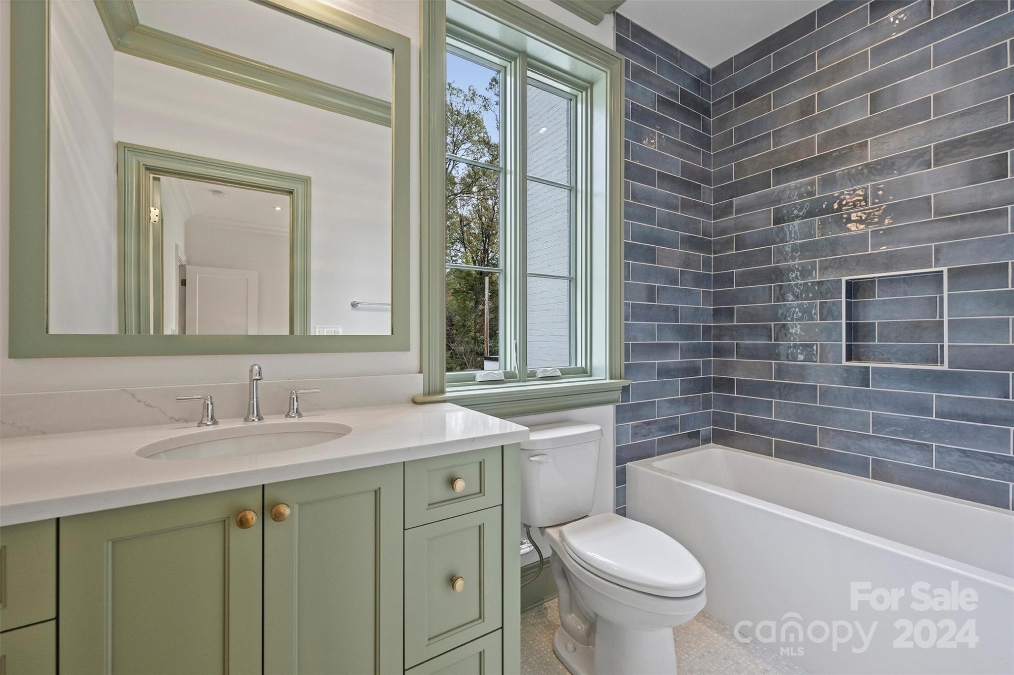 1601 Coventry Road Charlotte, NC 28211 - Photo 30 of 40 a bathroom with a granite countertop toilet a sink and a bathtub
