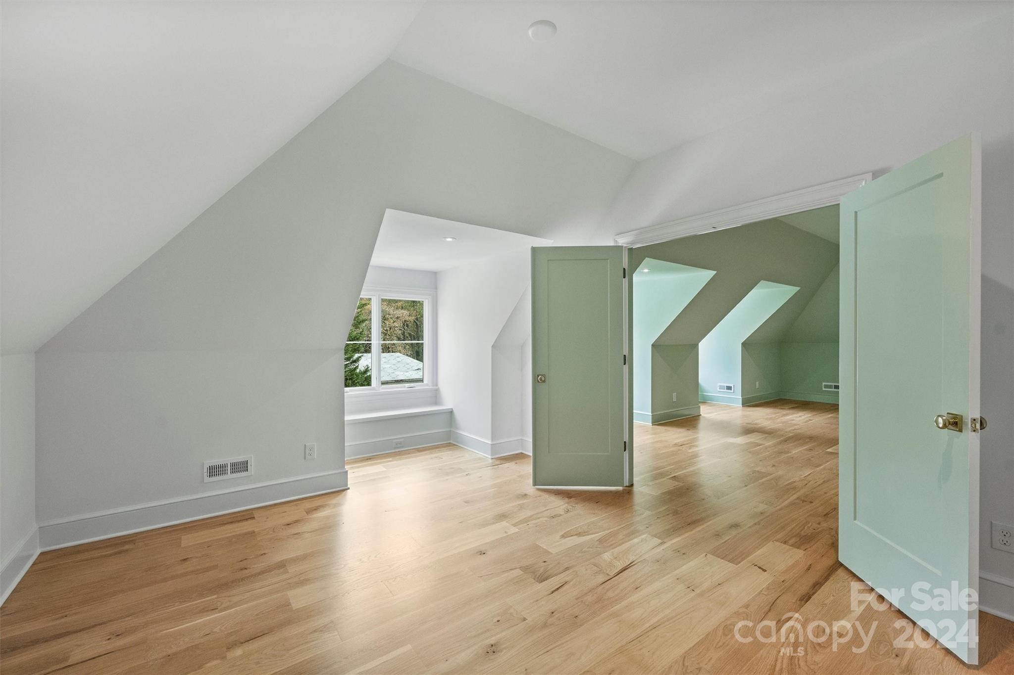 1601 Coventry Road Charlotte, NC 28211 - Photo 32 of 40 a view of a big room with wooden floor and windows