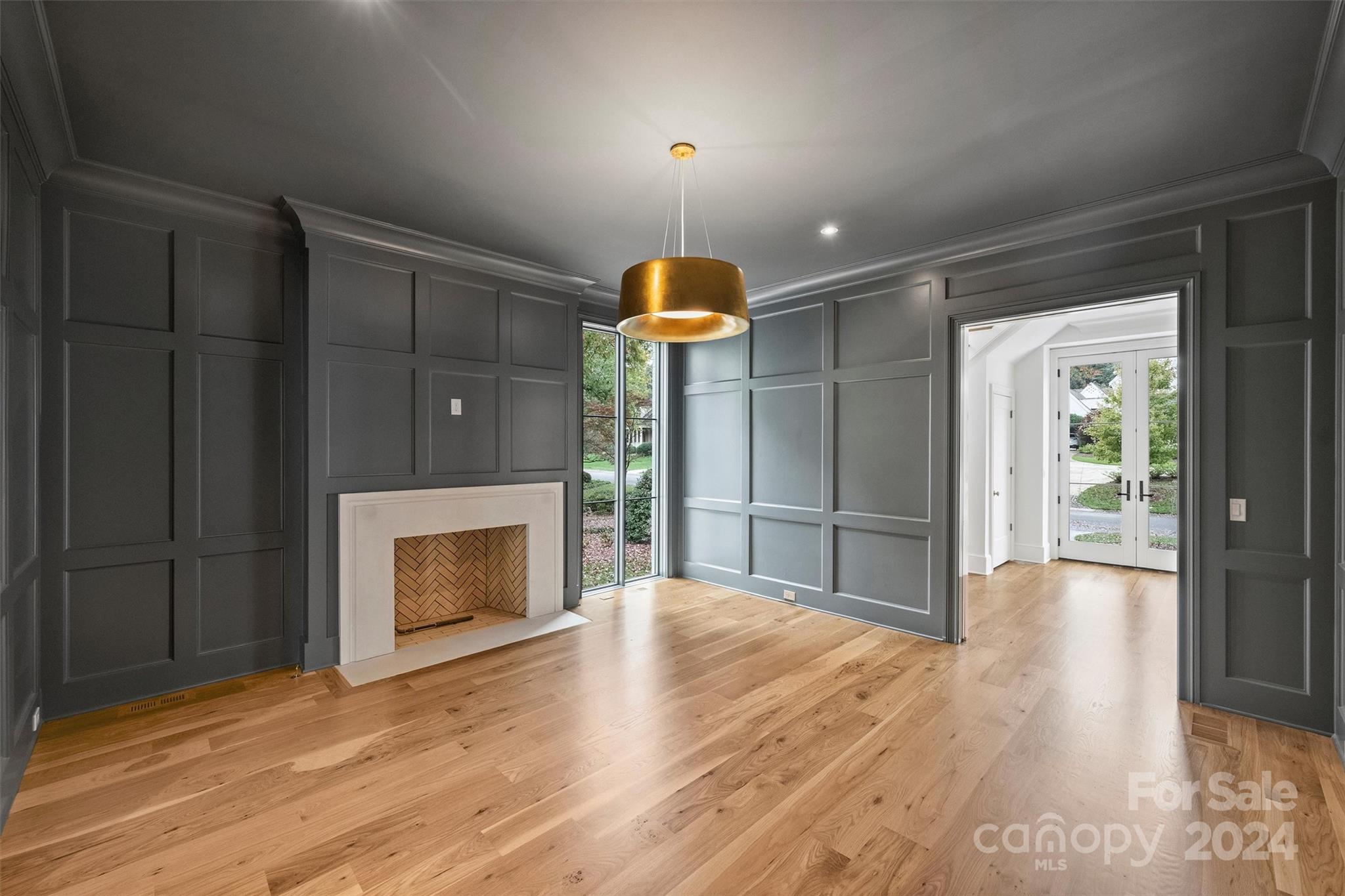 1601 Coventry Road Charlotte, NC 28211 - Photo 5 of 40 a room with chandelier and fireplace