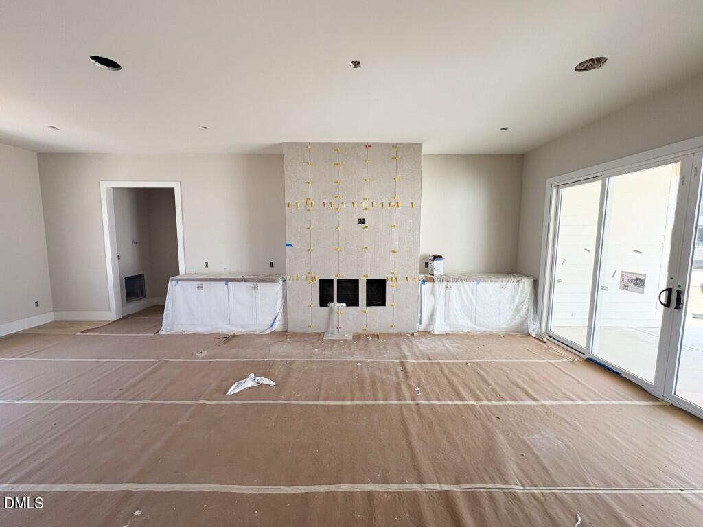 5864 Carriage Gate Drive Raleigh, NC 27603 - Photo 9 of 37 a view of a livingroom with furniture and a fireplace