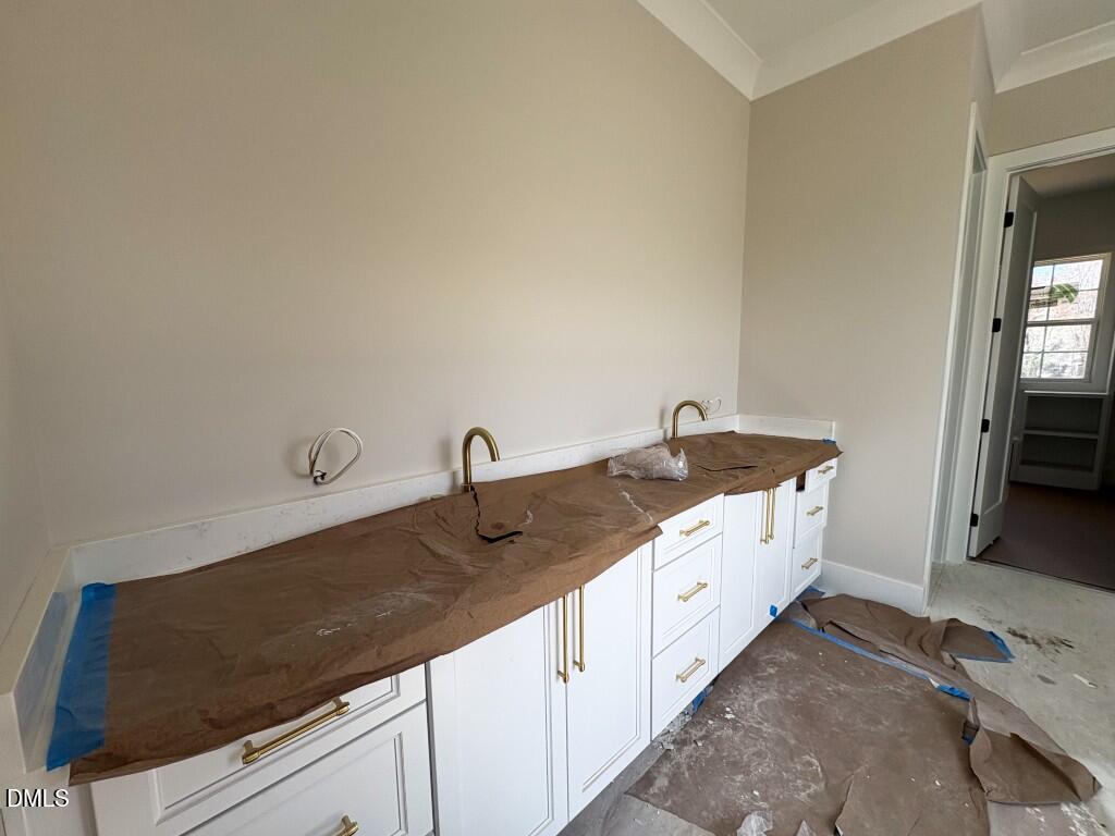 5864 Carriage Gate Drive Raleigh, NC 27603 - Photo 11 of 37 a kitchen with a sink and cabinets