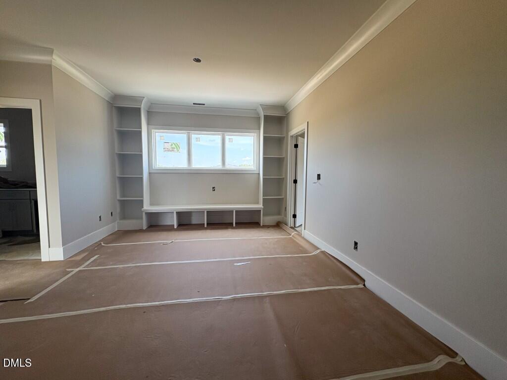5864 Carriage Gate Drive Raleigh, NC 27603 - Photo 16 of 37 a view of an empty room with a window