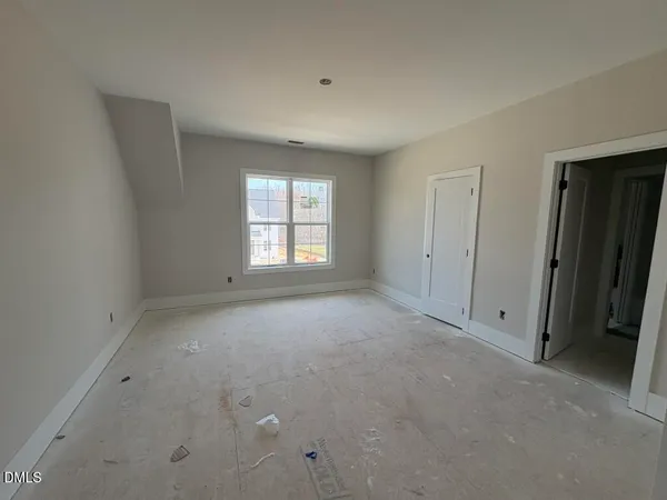 a bathroom with a tub and toilet