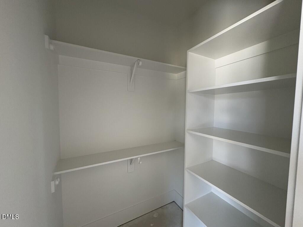 5864 Carriage Gate Drive Raleigh, NC 27603 - Photo 23 of 37 a view of an empty walk in closet