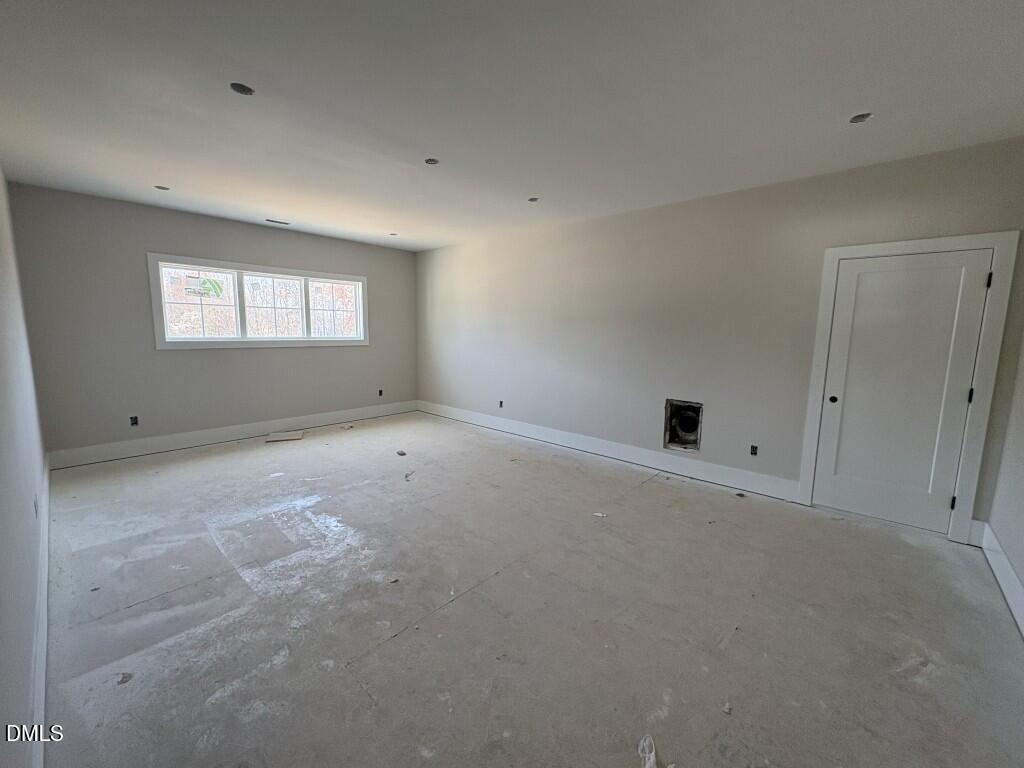 5864 Carriage Gate Drive Raleigh, NC 27603 - Photo 27 of 37 an empty room with a window
