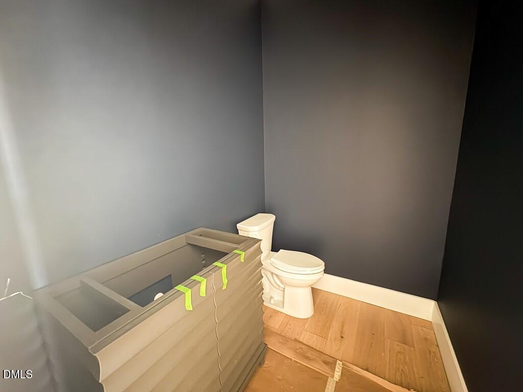 5864 Carriage Gate Drive Raleigh, NC 27603 - Photo 28 of 37 a bathroom with a sink and a toilet