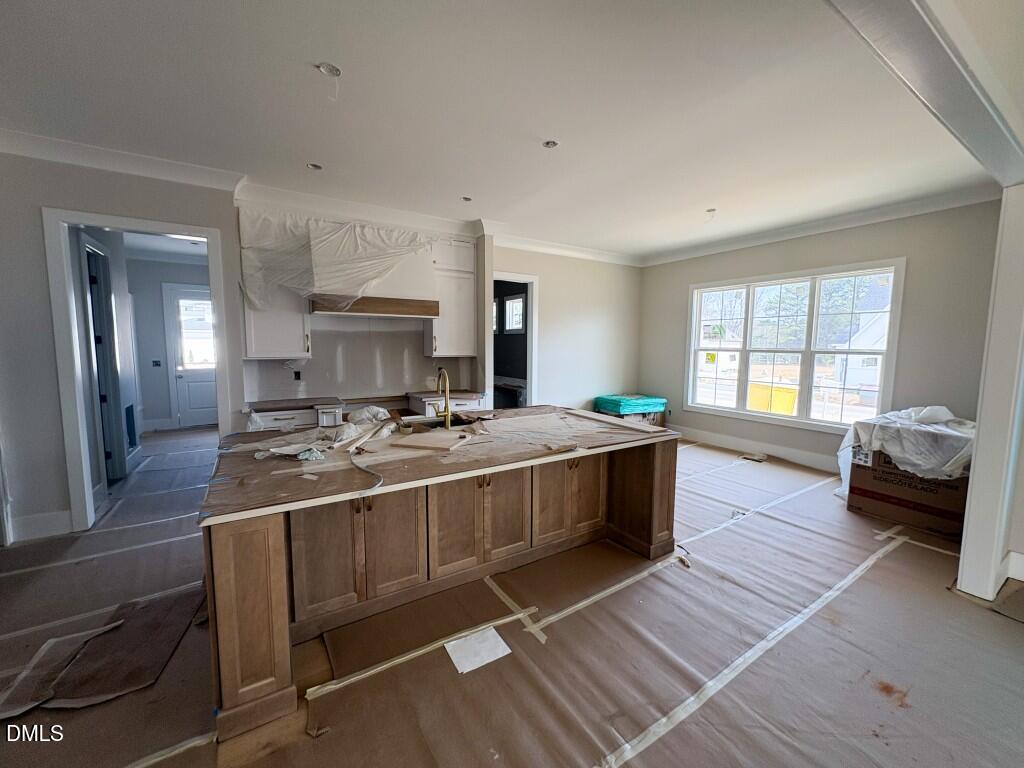5864 Carriage Gate Drive Raleigh, NC 27603 - Photo 6 of 37 a large white kitchen with a large window